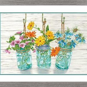 May include: A framed print featuring three hanging mason jars filled with colorful flowers. The jars are suspended by rope and set against a white wood-plank background. The flowers include pink, yellow, orange, and blue blooms.