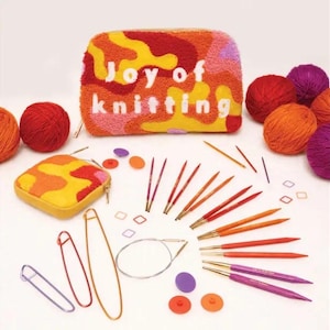 May include: A collection of knitting supplies, including yarn balls in red, orange, and purple, knitting needles, stitch markers, and a zippered pouch. The pouch and a smaller coin purse feature a colorful abstract design, with the words "Joy of knitting" on the larger pouch.