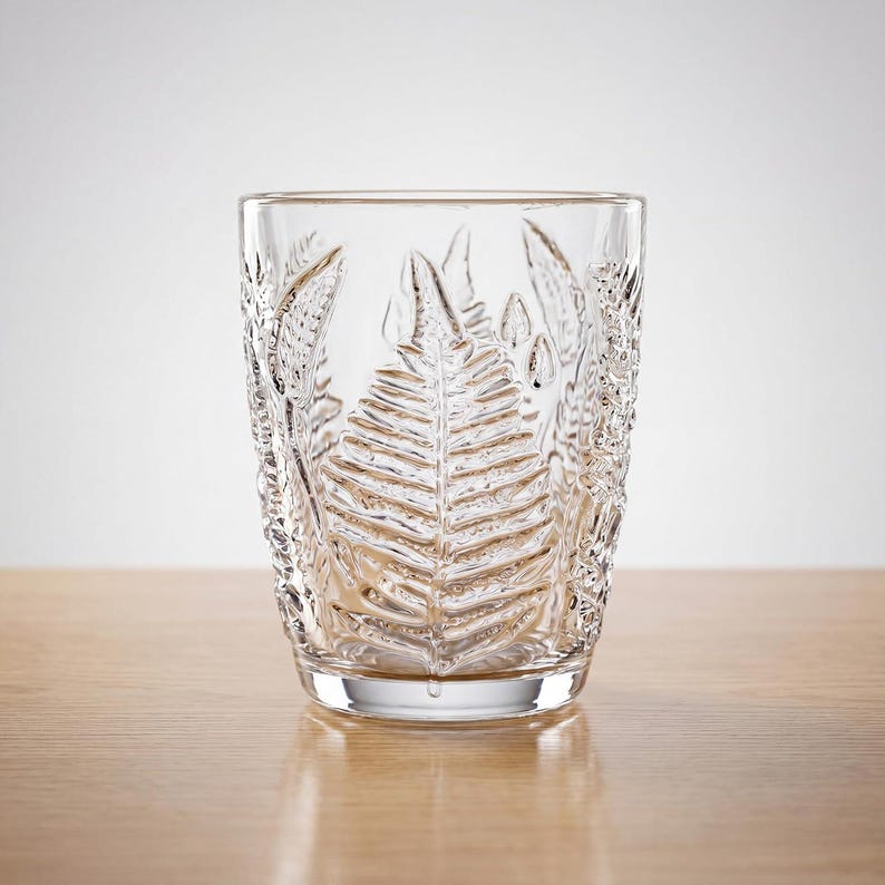 Short embossed fern glass tumbler, vintage style lowball drinking glass, textured clear glassware for whiskey, juice or water, retro aesthetic glass cup with botanical pressed pattern, durable everyday use
