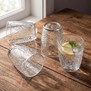 Clear embossed fern tumblers set, textured vintage drinking glasses displayed on wooden surface, retro glassware collection for water, juice and cocktails, durable pressed glass design with botanical pattern