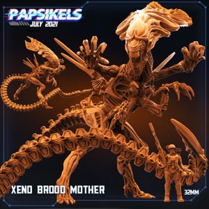Peut inclure: Modèle 3D marron détaillé d'une Xeno Brood Mother, créature avec une grande tête, plusieurs membres et une queue segmentée. Le modèle comprend un petit alien et une figurine de soldat. Le texte "XENO BROOD MOTHER" est visible.