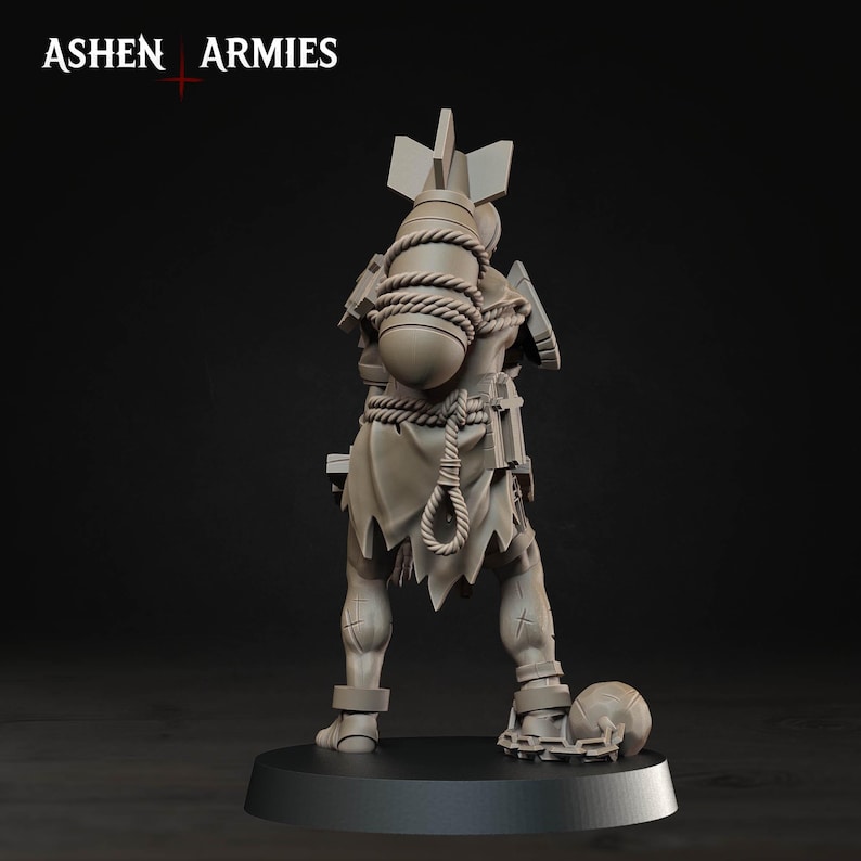 Pode incluir: Uma miniatura cinza da Ashen Armies, vista de costas. A figura veste uma roupa esfarrapada, carrega uma bomba grande amarrada &agrave;s costas com uma corda e tem uma bola com corrente presa a um tornozelo, tudo sobre uma base circular.