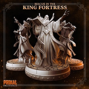 May include: Three detailed statues of a wizard with long robes and a beard, holding a book and raising a hand. The statues are on decorative bases, with the text "RESCUE IN THE KING FORTRESS" at the top and "PRIMAL COLLECTIBLES" at the bottom.