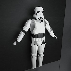 以下が含まれることがあります： スターウォーズシリーズのキャラクターである白いストームトルーパーのアクションフィギュアが、濃い灰色の背景に立っています。フィギュアは腕を広げた立ち姿です。フィギュアのアーマーは、ヘルメット、チェストプレート、レッグアーマーなど、細部まで作り込まれています。