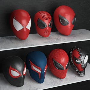 May include: A collection of eight superhero masks, primarily red, black, and blue, displayed on shelves. The masks feature various designs, including web patterns and distinctive eye shapes, reminiscent of the Spider-Man character.