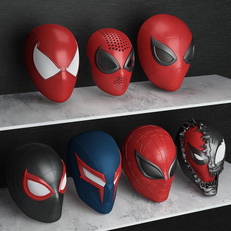 May include: A collection of eight superhero masks, primarily red, black, and blue, displayed on shelves. The masks feature various designs, including web patterns and distinctive eye shapes, reminiscent of the Spider-Man character.
