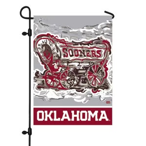 May include: A gray garden flag with a red and white wagon design. The wagon has the word "Sooners" on the side and the words "Oklahoma" at the bottom.