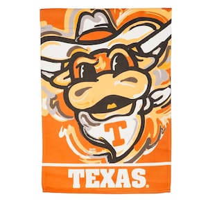 May include: Orange and white garden flag with a cartoon mascot of a bull wearing a cowboy hat. The bull has a big smile and the text "TEXAS" is printed below the mascot.