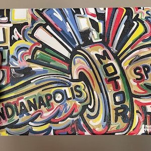 May include: A colorful abstract painting on canvas with the words "Indianapolis Motor Sports" in black and gold lettering. The painting features a variety of colors, including red, yellow, blue, green, and black. The artist's signature, "Justin Patten", is in the bottom right corner.