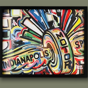 May include: A framed abstract painting with a colorful design featuring the words "Indianapolis Motor Speedway" in a bold, stylized font. The painting is dominated by a large, circular shape with a swirling, abstract design in shades of blue, green, yellow, red, and black.