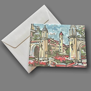 May include: A colorful illustration of a university campus with a tall building and a large archway. The illustration is painted in a bright, whimsical style with a blue sky and green trees.