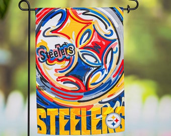 May include: A colorful garden flag with an abstract design featuring a football and the word "Steelers". The flag is yellow, red, blue, black, and white. The Steelers logo is in the bottom right corner.