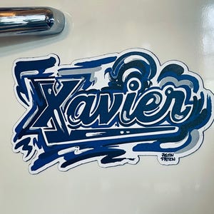 Xavier University Script Magnet  by Justin Patten (Storm Striker Art, The Blue Blob, D'Artagnan, Cincinnati, Ohio, One for All)