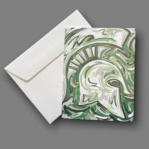 May include: A green, white, and gray abstract design of a Spartan helmet. The helmet is outlined in black and has a white crest. The background is a swirling pattern of green, white, and gray.