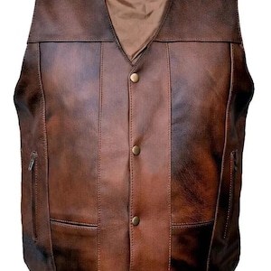 May include: A brown leather vest with a V-neck and a button-up front. The vest has two front pockets and two side pockets with zippers. The vest has a brown satin lining and a small label inside the collar.