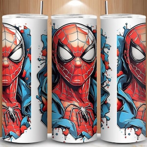 May include: White tumbler featuring a vibrant illustration of Spider-Man. The design showcases Spider-Man's iconic red and blue suit, with a detailed spider emblem. The artwork includes a blue background with red paint splatters, creating a dynamic look.