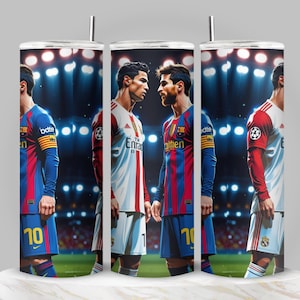 May include: A stainless steel tumbler featuring a vibrant illustration of soccer players in their team uniforms. The design showcases a stadium backdrop with bright lights, and the players are in a face-off. The tumbler is approximately 8 inches tall.