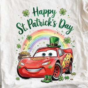 May include: White t-shirt featuring a red cartoon car wearing a green leprechaun hat, with the text "Happy St. Patrick's Day". A rainbow, pot of gold, and shamrocks complete the festive design.