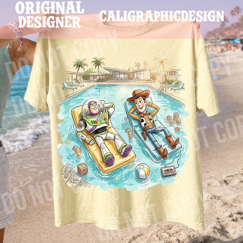 May include: Yellow t-shirt featuring a cartoon illustration of Buzz Lightyear and Woody relaxing in a pool. The design includes a pool, palm trees, and the text "CALIGRAPHICDESIGN" at the top. The shirt is held up by a person.
