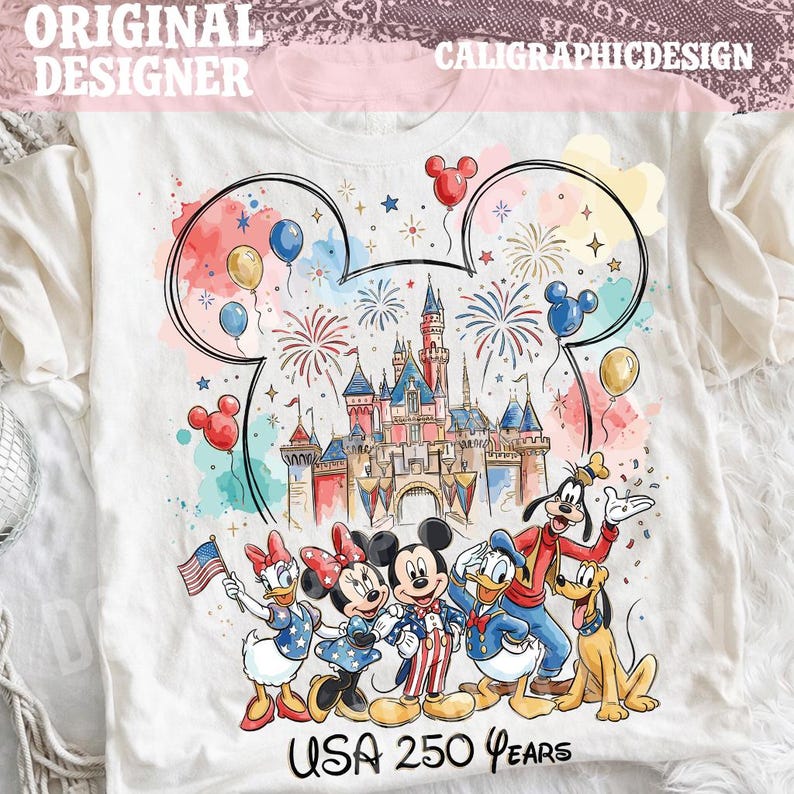 May include: White t-shirt featuring a colorful graphic of a castle, fireworks, and Mickey Mouse ears. The design includes Mickey, Minnie, Donald, Daisy, Goofy, and Pluto. Text at the bottom reads "USA 250 Years".