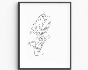 May include: Black framed art print featuring a minimalist line drawing of a hand playing a guitar. The black and white illustration shows the hand's fingers on the strings and the guitar's body, with a cable connected to the instrument.