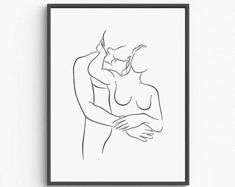 May include: Black framed minimalist art print featuring a line drawing of two figures embracing. The artwork depicts a man and a woman in a close embrace, with the woman's arms around the man's waist. The line art is on a white background.