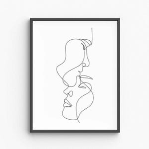 May include: Black framed art print with a minimalist line drawing of two faces in profile, one above the other. The artwork is a continuous black line on a white background, creating a modern and abstract design.