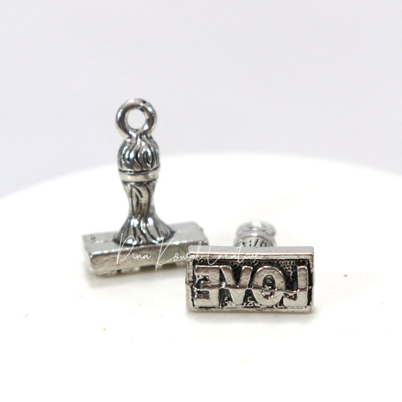rubber love stamp charm pewter charm, silver finish, 3D image 1