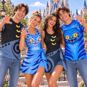 May include: Two t-shirts and two sleeveless dresses featuring a blue cat graphic with yellow eyes and sharp teeth. The apparel includes black and blue color schemes with circular patterns and yellow crescent accents on the chest area.