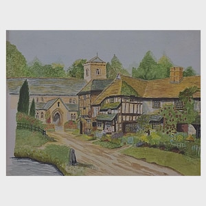 May include: A watercolour painting of a picturesque village. The image shows a church and timber-framed buildings with thatched roofs. A dirt track runs through the village, surrounded by greenery and a cloudy sky. The painting is framed in white.