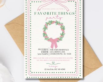 Puede incluir: Una tarjeta de invitación color crema con un borde rosa y verde, con el texto "Favorite Things Party". La tarjeta incluye una ilustración de corona y detalles del evento. También se ve un sobre de papel kraft y una bobina de cinta blanca.