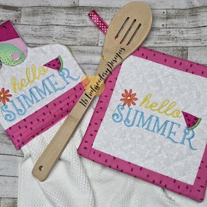 May include: Two embroidered kitchen towels with a watermelon and floral design. The towels say "hello summer" in colorful embroidery. One towel is a pot holder with a loop for hanging. The other towel is a square pot holder.
