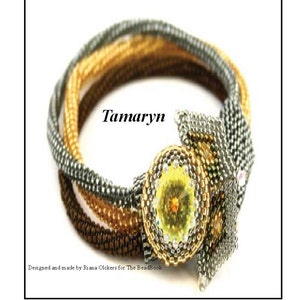 May include: A gold, brown, and silver beaded bracelet with a large yellow gemstone in the center. The bracelet is designed in a woven pattern and has the word "Tamaryn" written on it.
