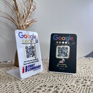 May include: Two review cards, one white and one black, with the Google logo and a QR code. The white card has the First Command logo and text. The black card has Arabic text and a logo. Both cards have a five-star rating graphic.