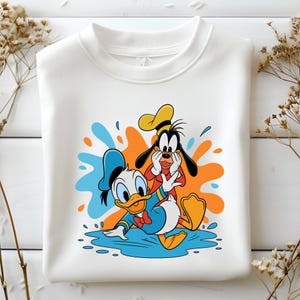 Donald y Goofy Splash PNG, Clipart de amigos de dibujos animados divertidos, Arte digital de juegos acuáticos de verano, Archivo de sublimación de dúo clásico, Descarga instantánea