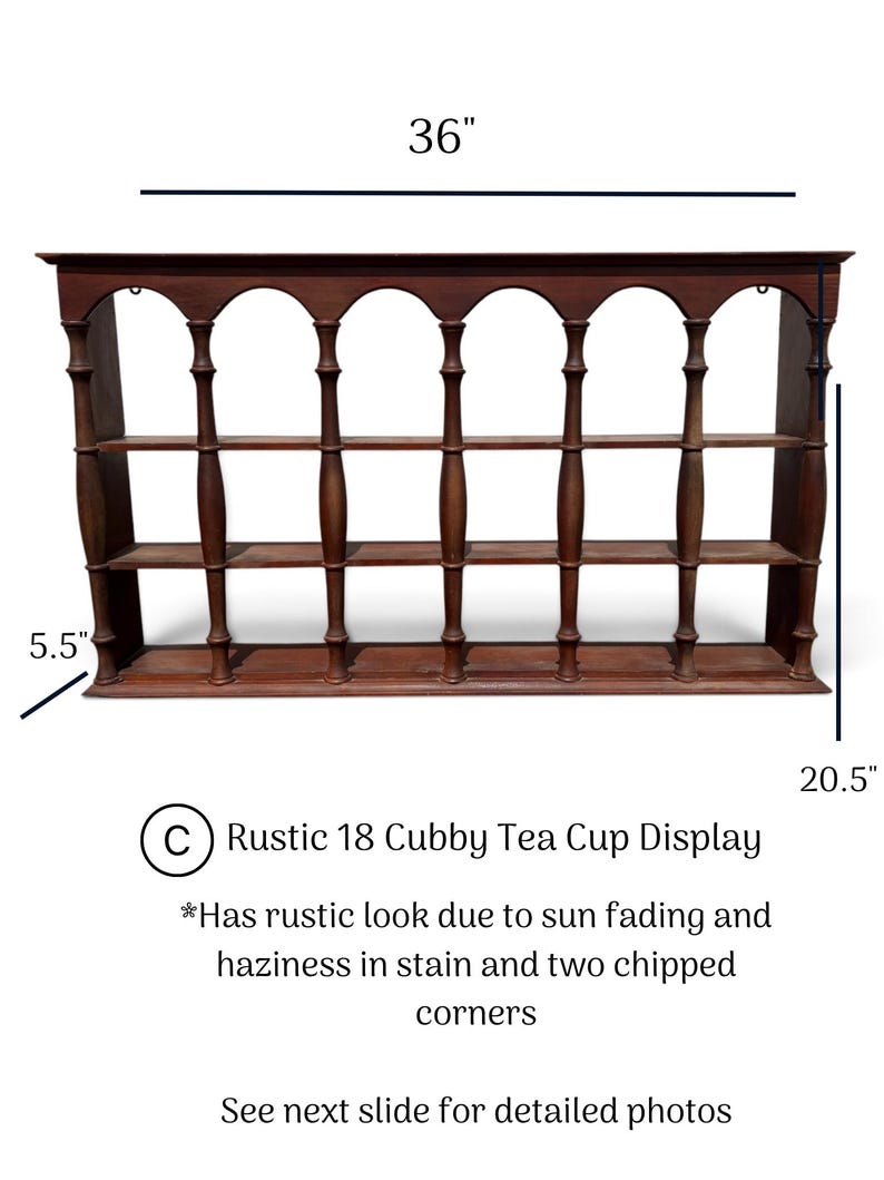 May include: A brown wooden display shelf with 18 cubbies, featuring arched top openings and spindle-style vertical supports. The unit measures 36 inches wide, 20.5 inches high, and 5.5 inches deep, showing sun fading, stain haziness, and two chipped corners.