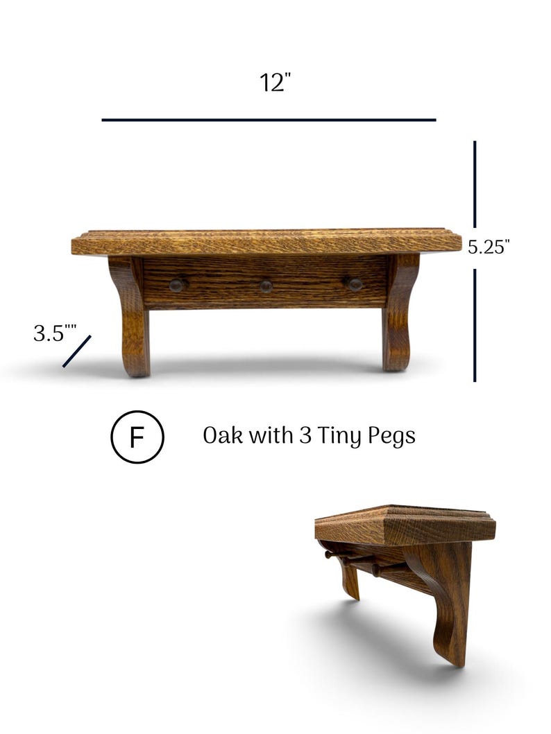 May include: A brown oak wall shelf featuring three small pegs. The shelf measures 12 inches in width, 5.25 inches in height, and 3.5 inches in depth. The text F Oak with 3 Tiny Pegs is displayed below the shelf, which is shown from front and side angles.