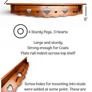 May include: A brown wooden wall shelf featuring three heart-shaped cutouts and four pegs. The shelf measures 40 inches wide, 8 inches high, and 5.5 inches deep. It includes a plate rail indent on the top surface and off-center mounting holes.