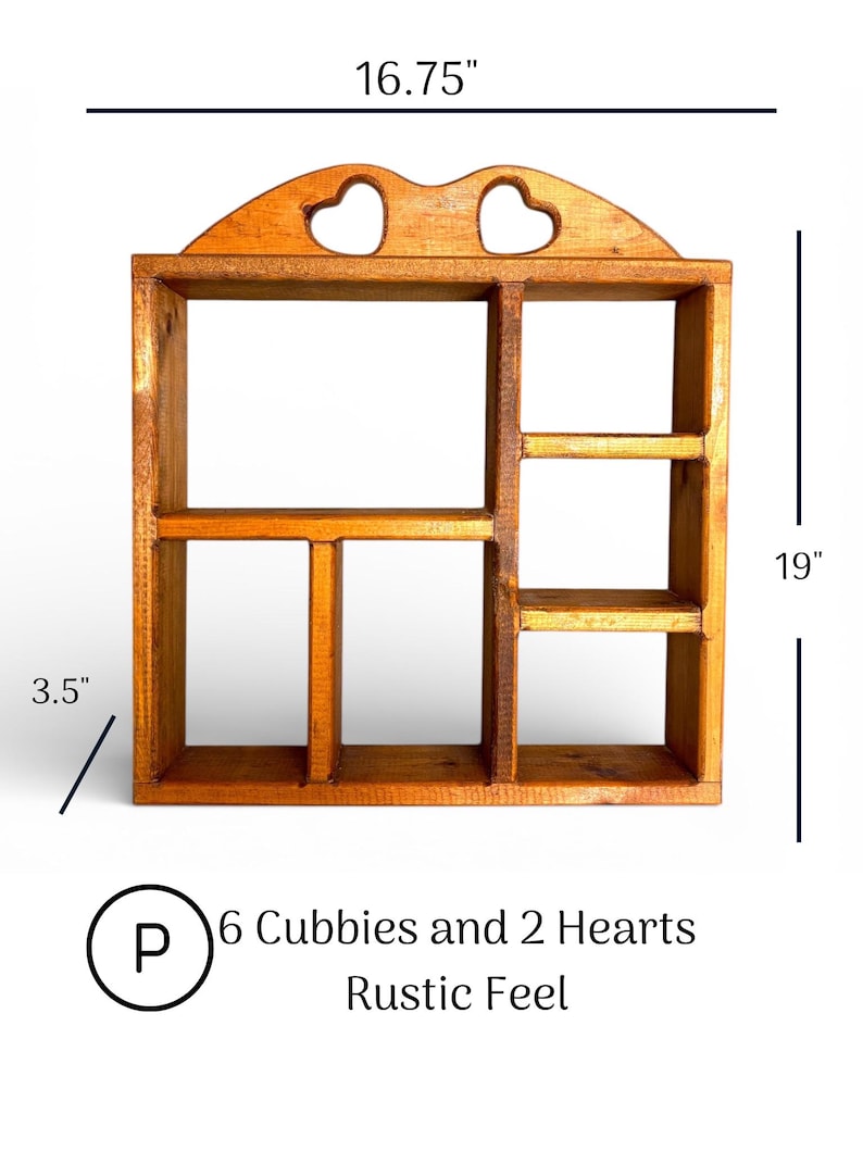 May include: A wooden wall shelf with six cubbies and two heart-shaped cutouts at the top. The shelf measures 16.75 inches wide, 19 inches high, and 3.5 inches deep. The text on the image reads: P 6 Cubbies and 2 Hearts Rustic Feel.