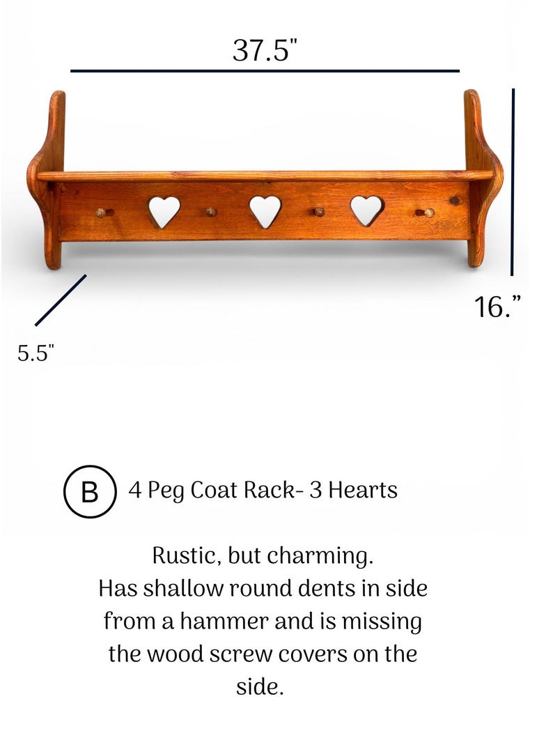 May include: A wooden coat rack with four pegs and three heart-shaped cutouts. The rack measures 37.5 inches wide, 16 inches high, and 5.5 inches deep. It features visible hammer dents on the side and lacks wood screw covers on the side.