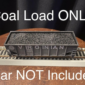 May include: A black coal load for a model train car. The load is labelled "Virginian" and "VGN 24254". The text "Coal Load ONLY" is at the top of the image and the text "Car NOT Included" is at the bottom of the image.