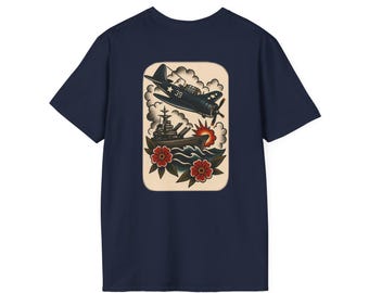 May include: Navy blue t-shirt featuring a vintage-style graphic. The graphic depicts a black airplane and a battleship with red flowers and waves. The design is set against a cream-colored background.