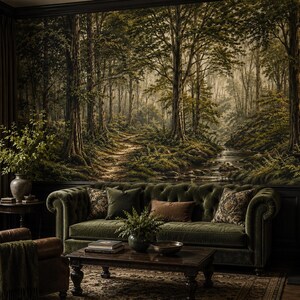 May include: A large wall mural depicting a dense forest scene with tall trees, a winding dirt path, and a flowing stream. The mural features deep green and earthy brown tones, covering the entire wall behind a tufted olive green velvet sofa.