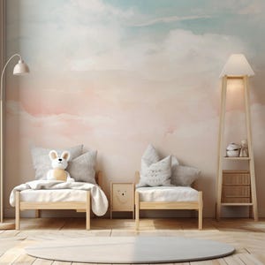 May include: A children's bedroom with a pastel cloud mural. Two small wooden beds with white bedding and gray pillows are arranged in front of the wall. A stuffed animal and a framed picture are on the beds. A floor lamp and a tall shelf lamp are also in the room.