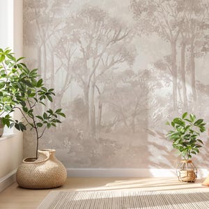 May include: A room featuring a forest-themed wallpaper, a window with plants, and an orange cushion. The wallpaper depicts a muted, grayscale forest scene. Plants in woven baskets and a metal cage add a natural touch to the interior.