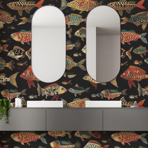 May include: Bathroom scene featuring a black fish-patterned wallpaper with colourful fish illustrations. Two oval mirrors are mounted above a grey vanity unit with white sinks. The fish are in red, gold, and blue.