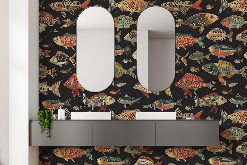 May include: Bathroom scene featuring a black fish-patterned wallpaper with colourful fish illustrations. Two oval mirrors are mounted above a grey vanity unit with white sinks. The fish are in red, gold, and blue.