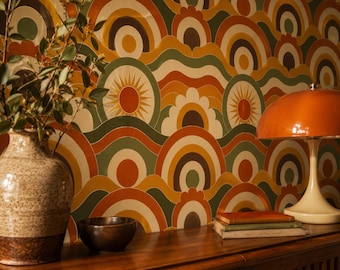 May include: Wallpaper featuring a repeating pattern of concentric circles, sunbursts, and wavy lines in shades of orange, yellow, brown, and green. The design includes stylized floral shapes and geometric arcs, creating a dense, colorful graphic surface.
