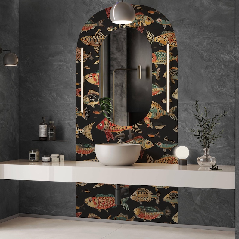 May include: A bathroom vanity with a large, arched mirror featuring a black background and a colourful fish pattern. The vanity has a white countertop with a white sink. The walls are dark grey.