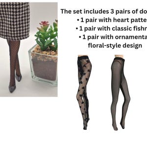 May include: A set of three pairs of doll tights. One pair features a heart pattern, another has a classic fishnet design, and the third showcases an ornamental floral-style design. The text on the image says: The set includes 3 pairs of doll tights.